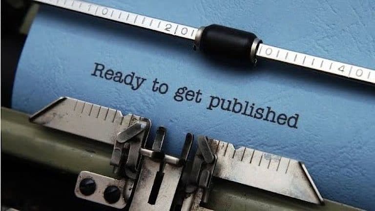 A document in a typewriter, ready to be published.